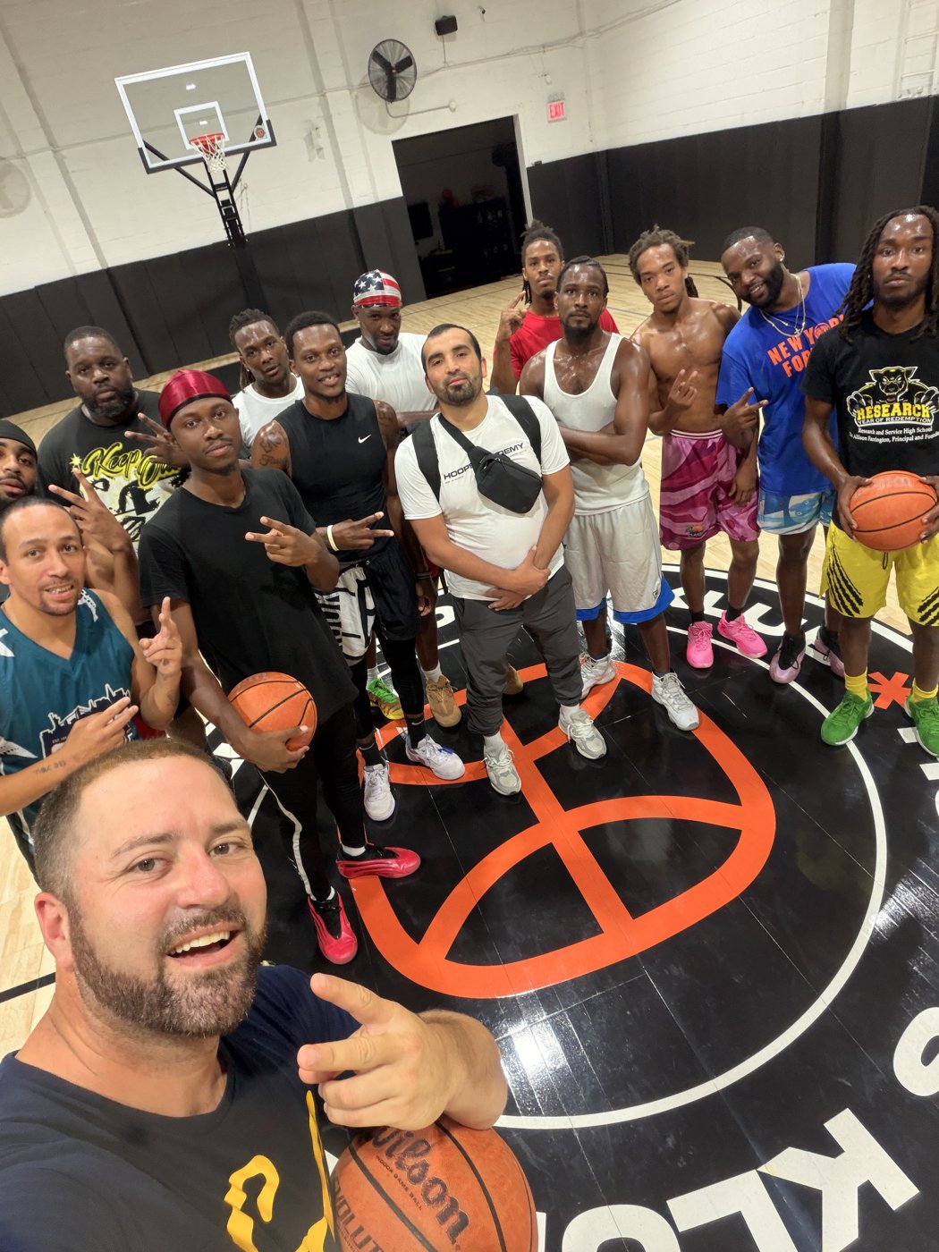 Community group photo on an indoor court