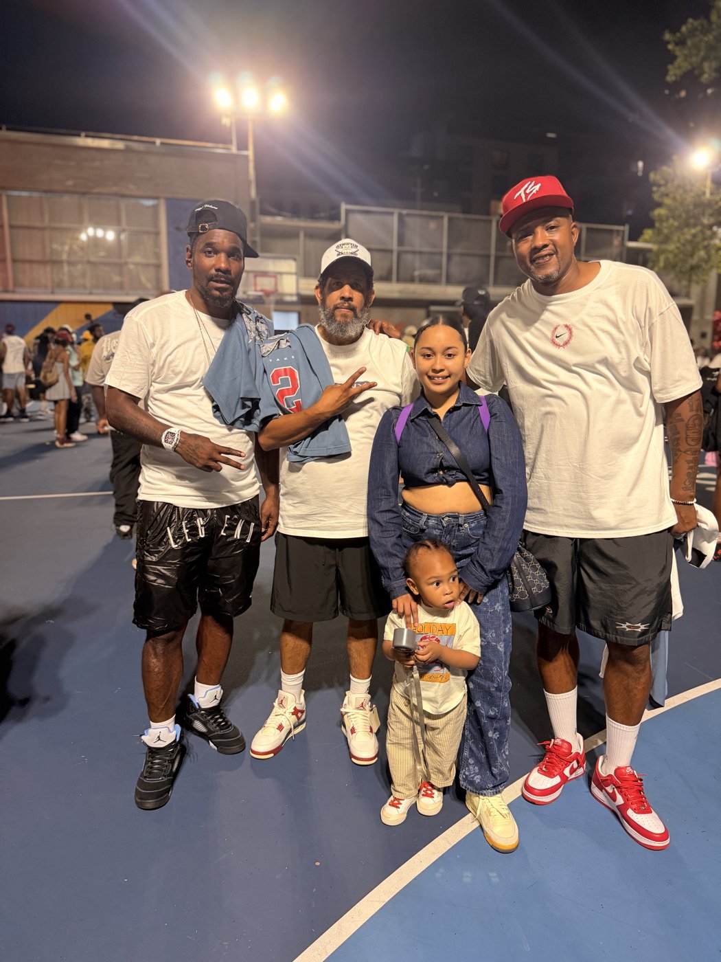 Group on an outdoor court at night
